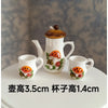 A set of handcrafted miniature ceramic mugs featuring an orange mushroom design on a white background.