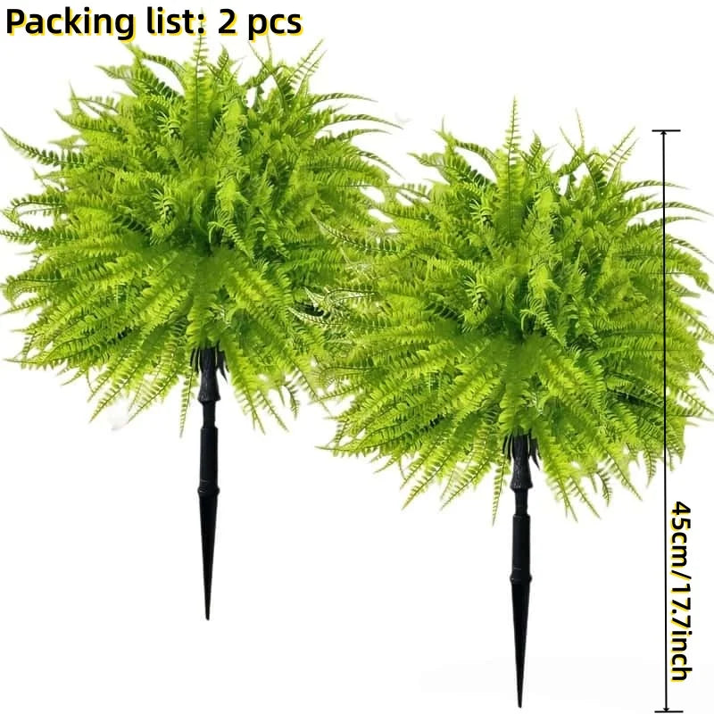Two artificial green Persian fern stakes for decoration.