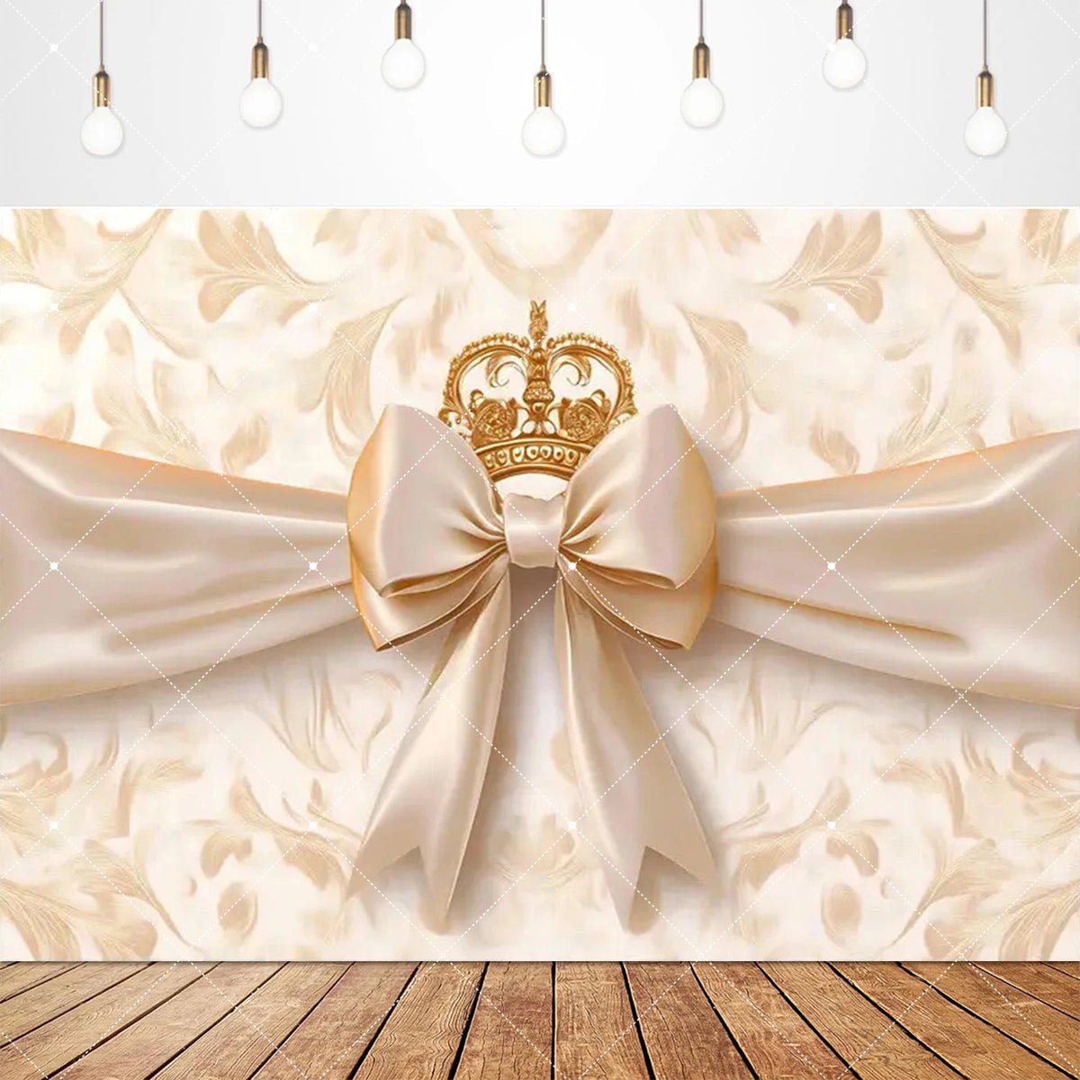 A beige floral backdrop featuring a gold crown and a satin pink bow tie banner for a birthday party.