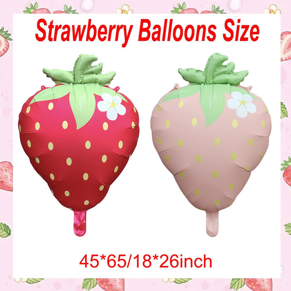 Two pink strawberry foil balloons showing the size 45x65x18x26 inches.