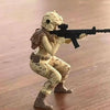 A female rifleman figurine in camouflage attire aiming a black rifle.