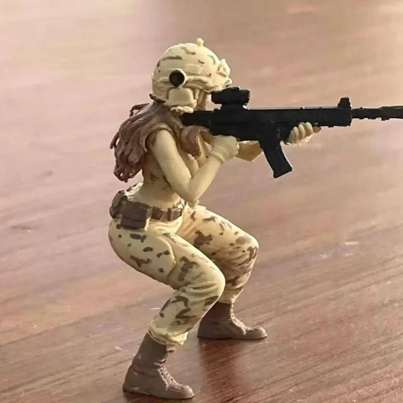 A female rifleman figurine in camouflage attire aiming a black rifle.