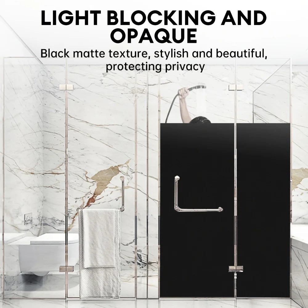 Black matte light blocking and opaque window film protecting privacy on a glass door.