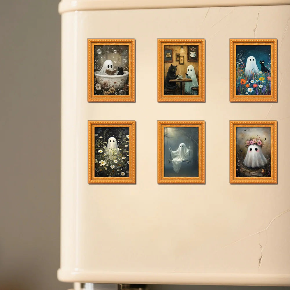 A close-up of a cream-colored fridge featuring five framed pictures of cute ghost Halloween characters.