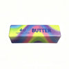 Bloc rectangulaire de beurre salé, 4 oz net, avec un design dégradé coloré.