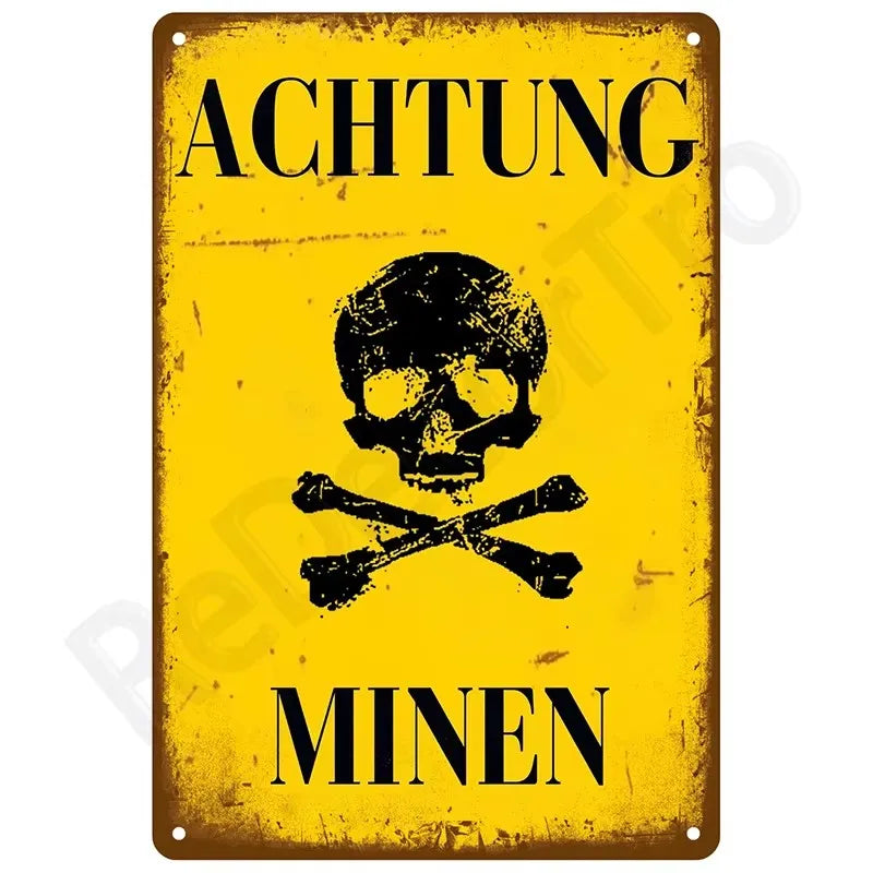Vintage yellow metal sign with black text warning about mines featuring a skull and crossbones symbol.