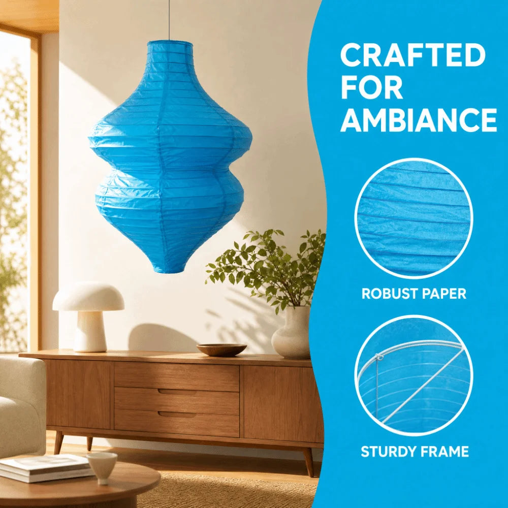 A bright blue, handcrafted paper lantern with a sturdy frame is displayed in a modern interior setting.