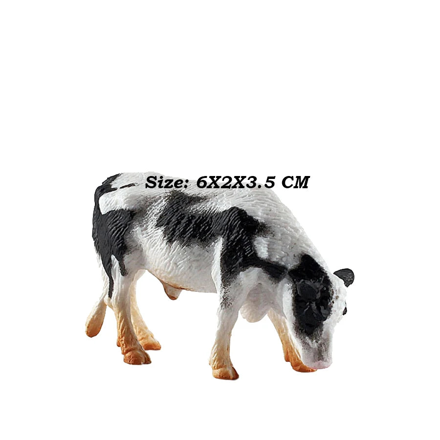 A figurine of a black and white cow model, measuring 6x2x3.5 cm.