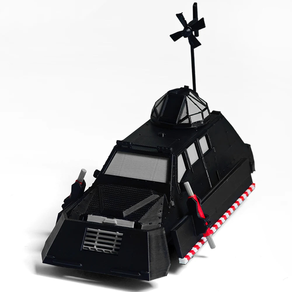A black armored car model resembling a Storm Chaser Tornado interceptor with a rotating antenna on top.