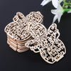 A stack of wooden angel ornaments with hemp rope, featuring various religious phrases and designs.