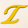 A yellow 3D acrylic letter T wall sticker on a light background.
