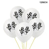 A bunch of 12 inch white balloons decorated with black and white checkered race car patterns.