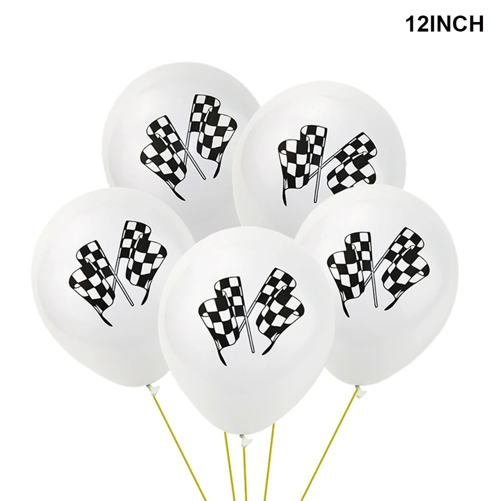 A bunch of 12 inch white balloons decorated with black and white checkered race car patterns.
