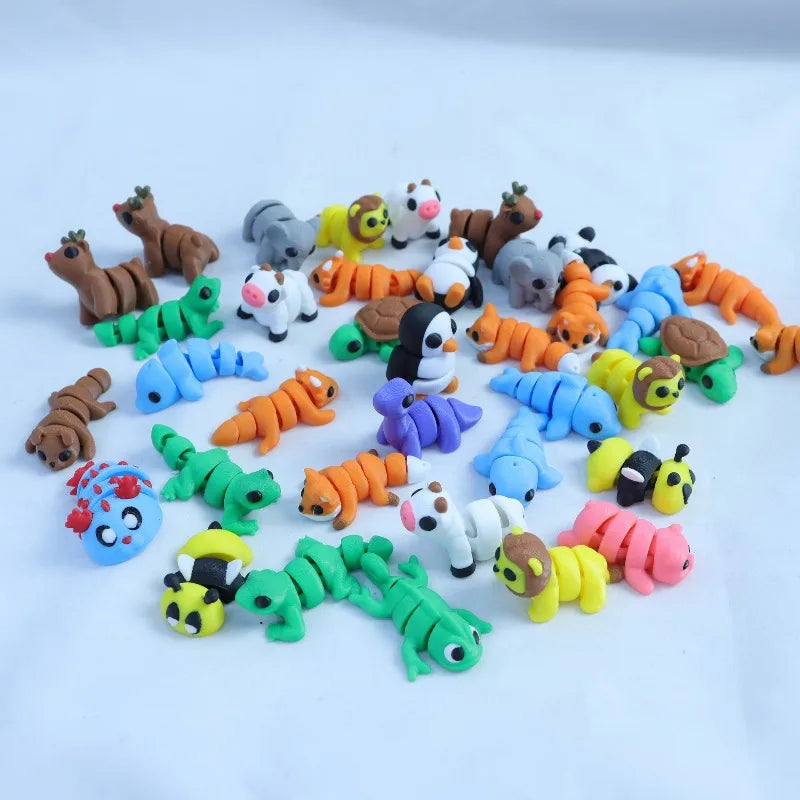 A collection of colorful 3D printed cartoon animal figurines including bears, cats, and other woodland creatures.