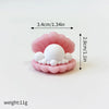 A set of pink edible cake toppers shaped like a whale, octopus, and turtle, measuring 3.4cm long and 2.8cm high.