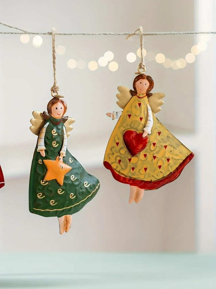 A set of four vintage wood angel Christmas tree ornaments hanging on a string against a light background.