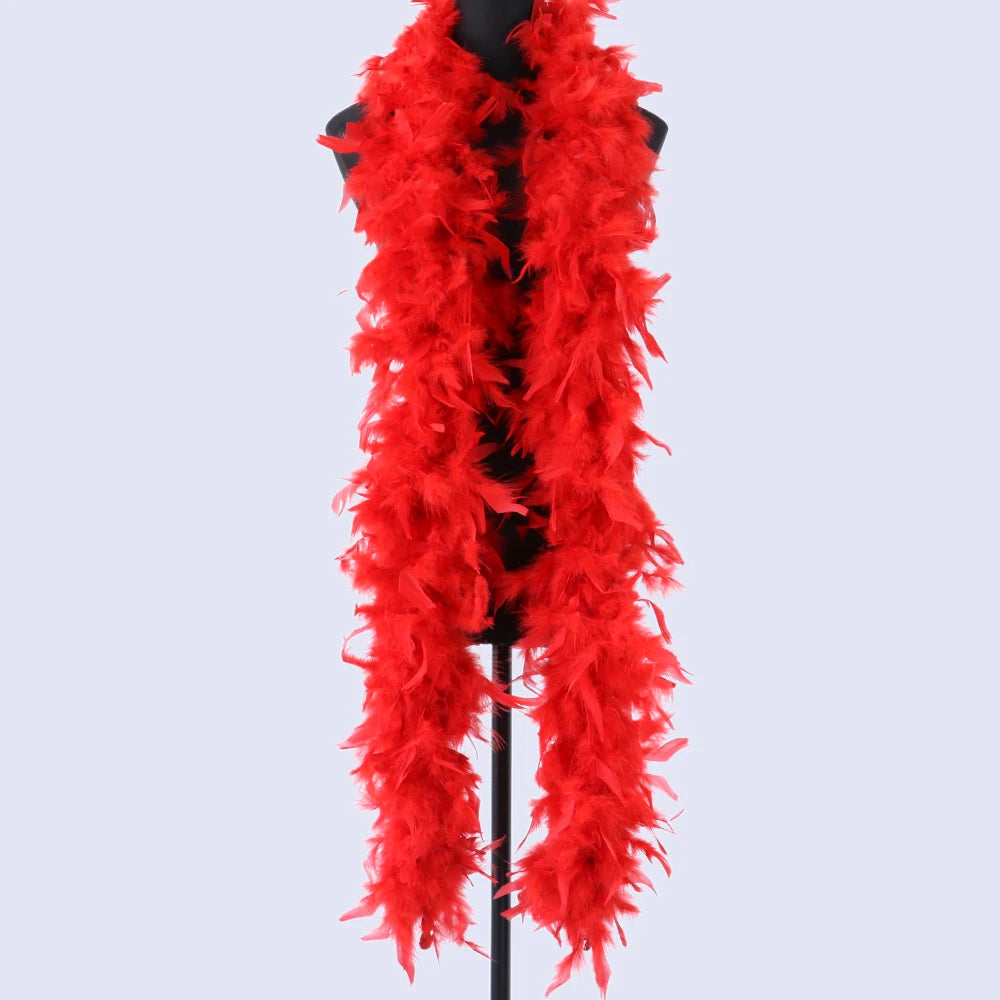 A vibrant red natural turkey feather boa displayed on a black hanger.