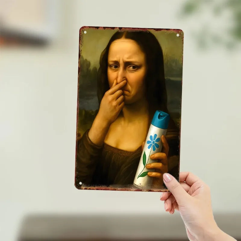 A hand holds a vintage metal framed portrait of a woman with an expression of distress.