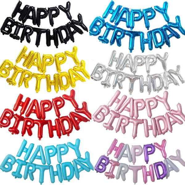 A set of foil balloons in black, gold, silver, red, and blue celebrating a happy birthday.