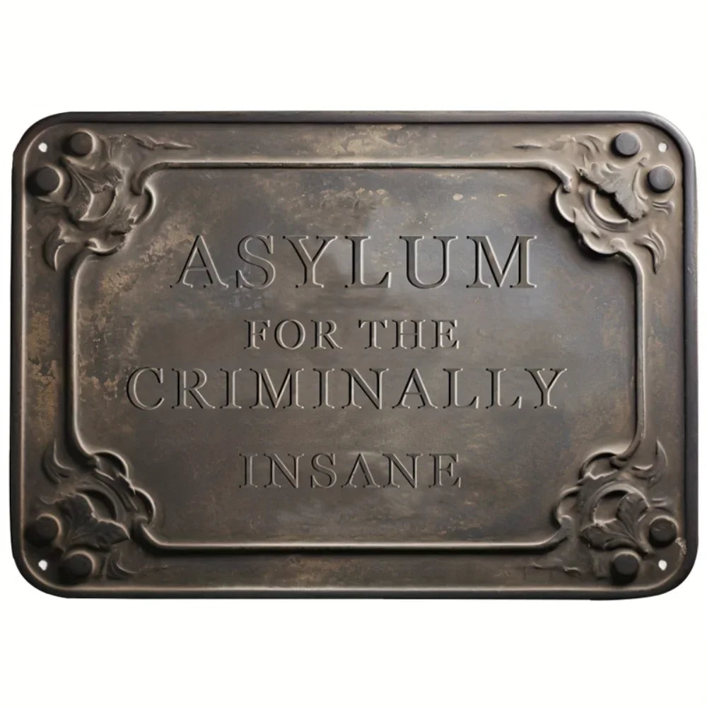 A vintage metal tin sign with raised lettering that reads Asylum for the Criminally Insane