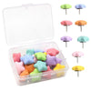 A clear storage box containing various colored decorative pentagram thumb tacks for crafting and display.