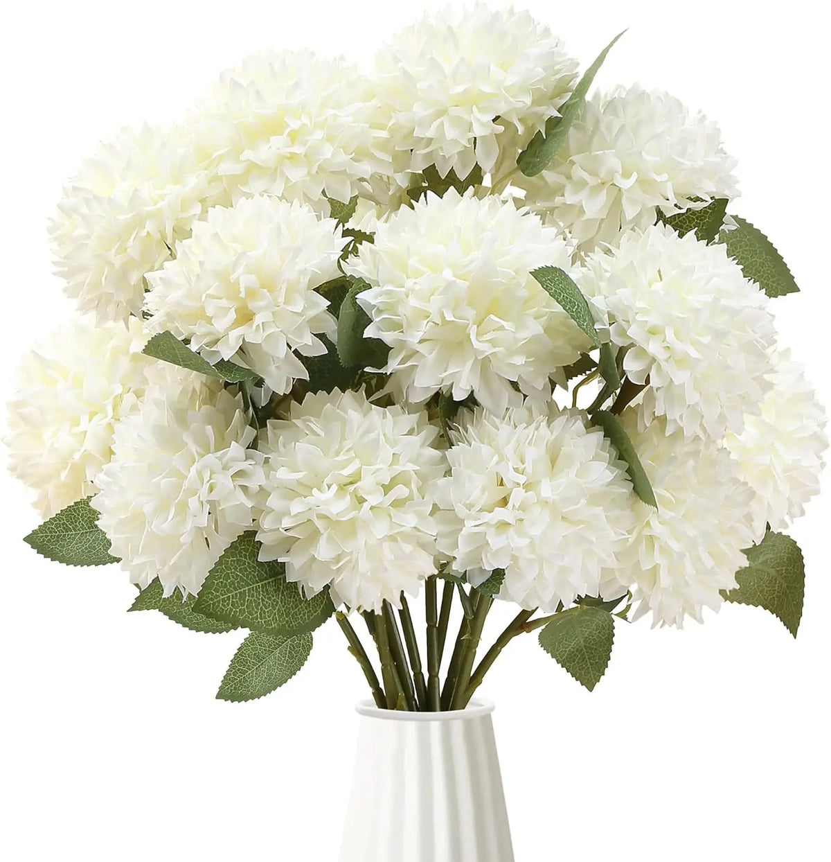 A bouquet of white artificial chrysanthemum flower balls with green leaves in a white vase.