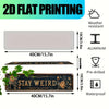 A rectangular metal wall sign with the text STAY WEIRD in gold lettering, designed for weather resistance and waterproof use.