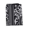 Black and white patterned portable travel prayer mat with compass.