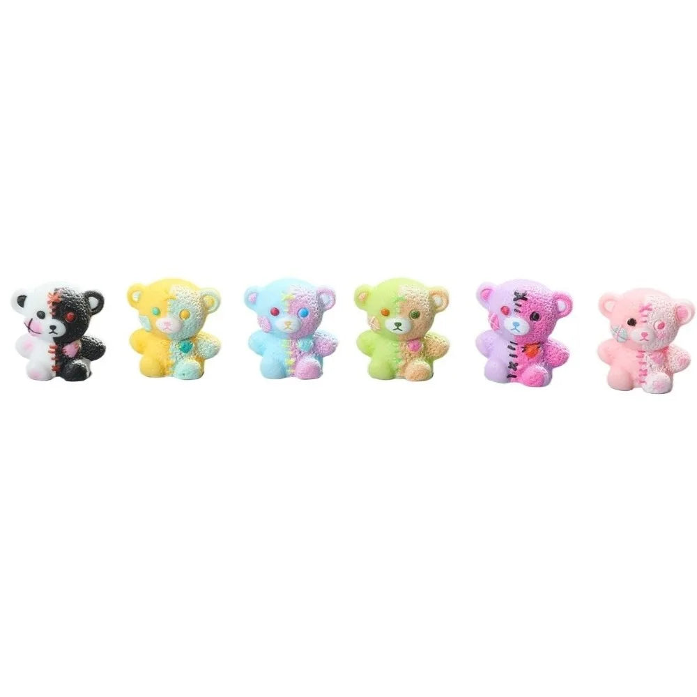 A set of five colorful resin figurines depicting bears with various expressions and colors.