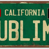 Vintage green metal sign with the word SUBLIME in distressed gold lettering and text for Long Beach California and Skunk reco