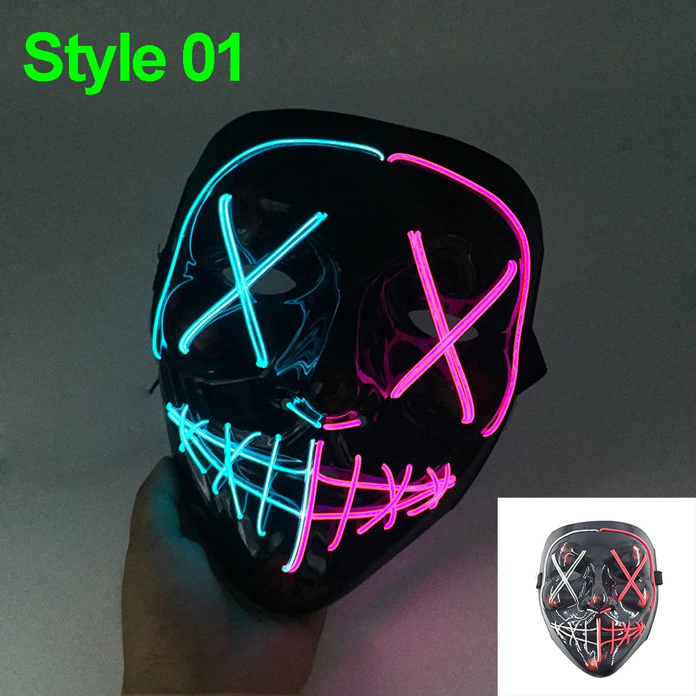 A black glow-in-the-dark LED purge mask with neon pink and blue glowing X shapes on a hand.