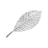 A delicate sterling silver tea brewing leaf with intricate veining.