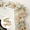 A long garland of artificial maple leaves and white berries used for autumn wedding or home decor