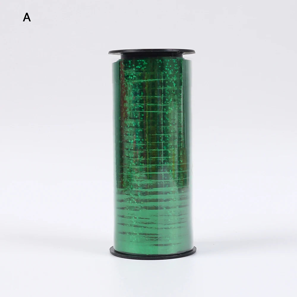 A roll of green glitter curling ribbon used for gift wrapping and party decor.