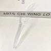A clear plastic cutlery set with a tapered design is shown resting on a white surface.