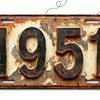 A vintage, weathered aluminum license plate with the year 1951 embossed on it.