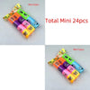 A collection of 24 colorful mini toys or party favors packaged in clear plastic bags.