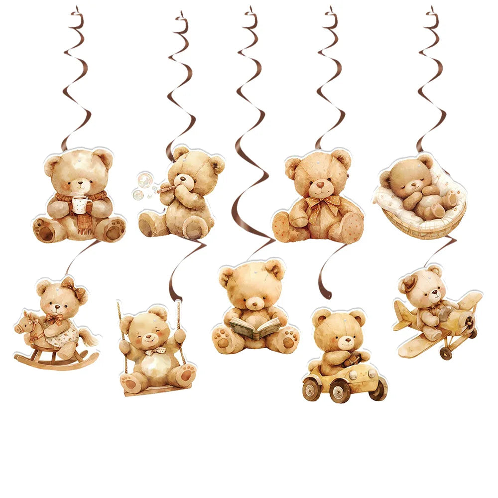 A banner featuring various teddy bears hanging from strings, some sitting, lying down, or being carried.
