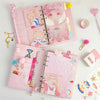 A pink luxury heart pendant diary set featuring a pink cover and decorative elements.