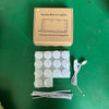 A box containing dimmable LED vanity mirror lights and associated wiring and bulbs.