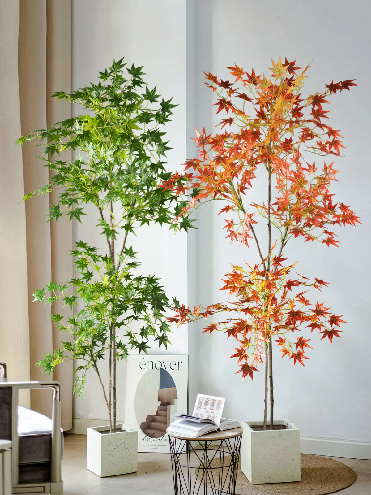 Artificial maple tree with silk leaves in shades of green and red displayed in a white planter.