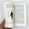 A page from the book Becoming Supernatural showing text and a silhouette of a person.