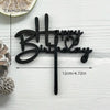 Black acrylic birthday cake topper with the words Happy Birthday on a stick