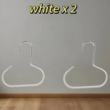 Two white hat organizer racks mounted on a light gray wall.