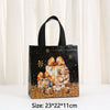 Black non-woven gift tote bag featuring a gold and silver holiday print of wrapped gifts and pinecones.