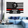 A custom photo American flag tapestry displayed on a wall above a blue sofa.