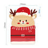 A cute, round reindeer face made of fabric, wearing a red Santa hat and a red scarf, used as a reusable Christmas gift bag.