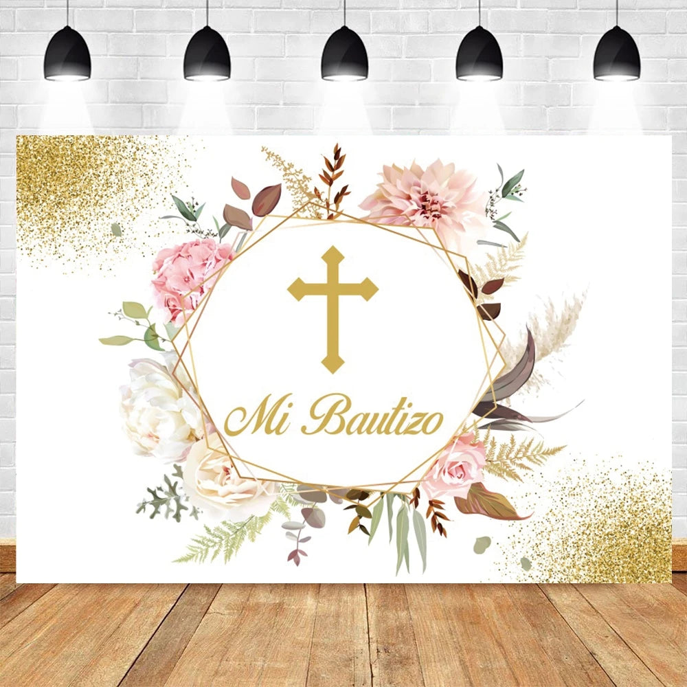 A white photography backdrop featuring gold glitter accents and floral greenery with a cross design for baptism or communion