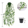 Artificial eucalyptus hanging plant with green leaves cascading from a black pot