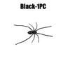 A realistic black spider magnet used for fun pranks or decoration on a fridge.